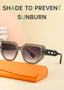 Detailed view of cat-eye sunglasses with hollow temples and an orange leather case