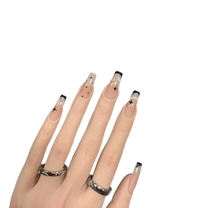 Long coffin fake nails with black french tips and silver glitter star patterns