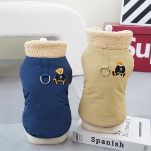 Detail of warm pet vests in blue and khaki featuring bear embroidery and D-ring harness buckle