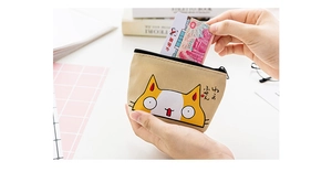 Close-up of a canvas cat coin purse showing card storage with a black zipper closure