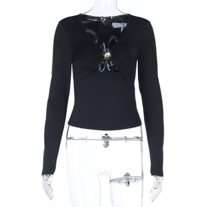 Close-up of V-neck pleated design and metal hardware on slim-fit black long-sleeve top