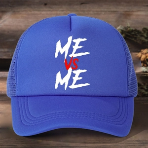 Blue trucker hat with ME VS ME print and breathable mesh back on dark wooden surface