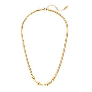 Detail of gold snake chain necklace with four golden beads and lobster clasp closure