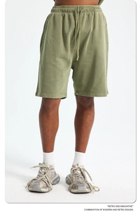 Detail of army green 420g cotton sweat shorts with adjustable drawstring and knit texture