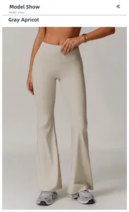 Detail of high waisted flare leggings in greyish apricot color on model in studio