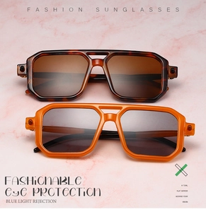 Detail of square double-bridge sunglasses in tortoiseshell and orange with blue light protection