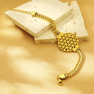Macro shot of 18K gold plated thick chain bracelet with a hollow circular geometric charm
