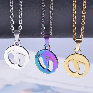 Polished stainless steel footprint pendant in gold, silver and rainbow finishes