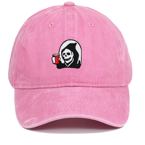 Close-up of Grim Reaper embroidery on pink washed cotton baseball cap with a red cup