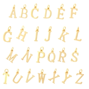 Full set of 26 golden alphabet metal pendants arranged neatly on a white background