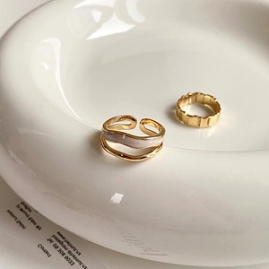 Luxurious gold textured wide ring and double-layer wave open ring on white tray