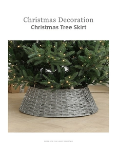 Detail of silver gray woven Christmas tree collar base with festive holiday decorations
