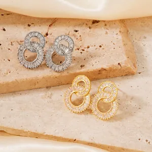 Sparkling pavé cubic zirconia double hoop earrings in gold and silver finish