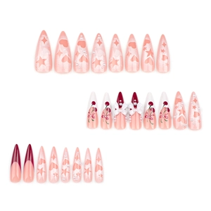 Pink French press-on nails with stiletto shape, cherry motifs, and 3D bow accents