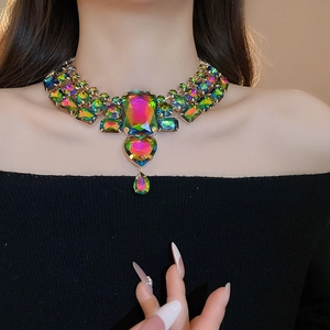 Detailed macro of vibrant rainbow heart and teardrop pendant necklace for women