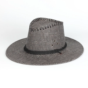 Close-up of dual-tone straw weave texture with black rope trim and metal eyelets