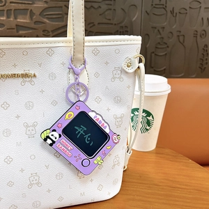 Cute purple panda doodle board keychain charm as a trendy accessory on a white tote bag