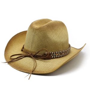 Classic straw cowboy hat with ethnic woven band and wide brim on white background