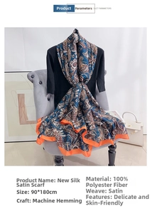 Detail showing paisley print satin scarf with navy blue base and machine-rolled hem