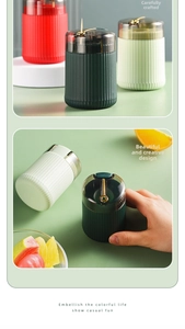 Detail showing hand using a modern push-button toothpick dispenser with vertical textures
