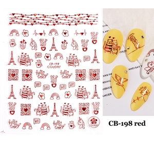 Detail of red 3D nail stickers showing heart and Eiffel Tower designs on nails