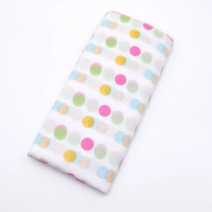 Close-up of colorful polka dot tissue paper for flower wrapping and gift packaging