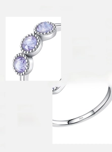 Detailed close-up of S925 sterling silver ring with purple zircon and S925 hallmark