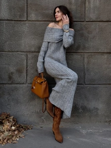 Detail of grey ribbed knit off-shoulder dress texture with long sleeves and slim fit design