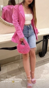 Pink plush woven tote bag styled with pink blazer and denim shorts for autumn