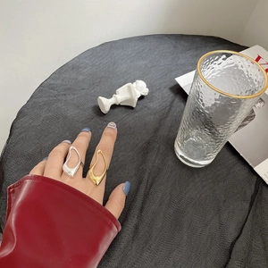 Irregular S925 sterling silver rings in gold and silver finish worn on fingers