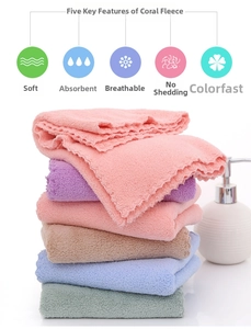Detailed view of thick soft coral fleece towels with scalloped edges in pastel colors