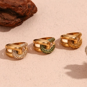 Three 18K gold plated chain rings featuring white green and amber crystal stones