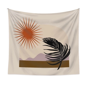 Détail d'une tapisserie bohème avec soleil orange et feuille de palmier sur tissu