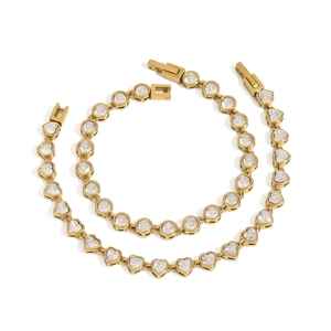 Gold stainless steel bracelet set with round and heart cut cubic zirconia stones