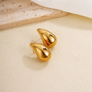 Minimalist golden teardrop stud earrings with a high-polished mirror finish and retro style