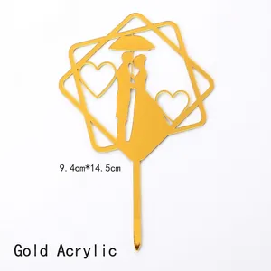 Detail view of gold acrylic couple silhouette cake topper measuring 9.4cm by 14.5cm