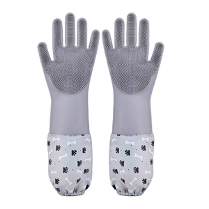 Gray waterproof silicone pet grooming gloves with scrubbing bristles and paw prints