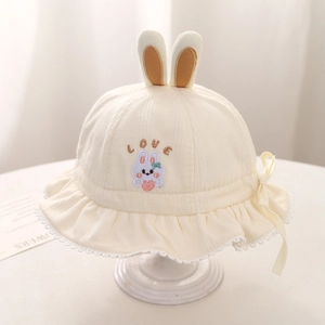 Detail of cream baby sun hat showing 3D bunny ears, love embroidery and lace trim edge