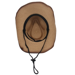 Detail view of woven straw cowboy hat with black sweatband and adjustable chin strap