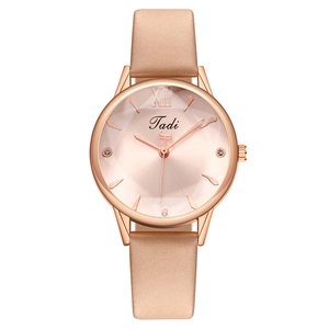 Elegant rose gold ladies quartz watch featuring a leather strap and rhinestone markers