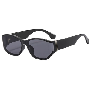 Oversized black curved sunglasses with thick frames and golden side metal accents