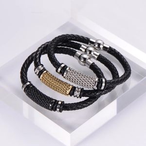 Detail of woven leather bracelets with stainless steel magnetic clasps in various colors
