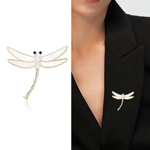 Exquisite gold dragonfly brooch with shell wings and crystals on black blazer lapel