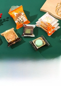 Detail of transparent mooncake packaging bags with rabbit motifs and product display