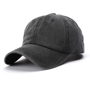 Detail view of washed cotton canvas baseball cap in charcoal gray with curved brim