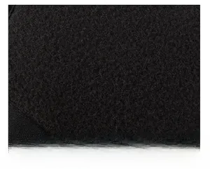 Detail of soft black winter baseball cap fabric showing adjustable strap and embroidery