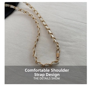 Detail of white leather interwoven with golden metal chain strap and swivel hook