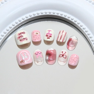 Pink cartoon bunny press-on nails with 3D bows and shimmering cat-eye finish