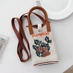 Cream knit crossbody phone bag with pumpkin pattern and brown strap on white background