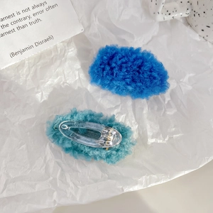 Candy-colored plush lamb wool hair clips in dark blue and cyan for winter hair styling